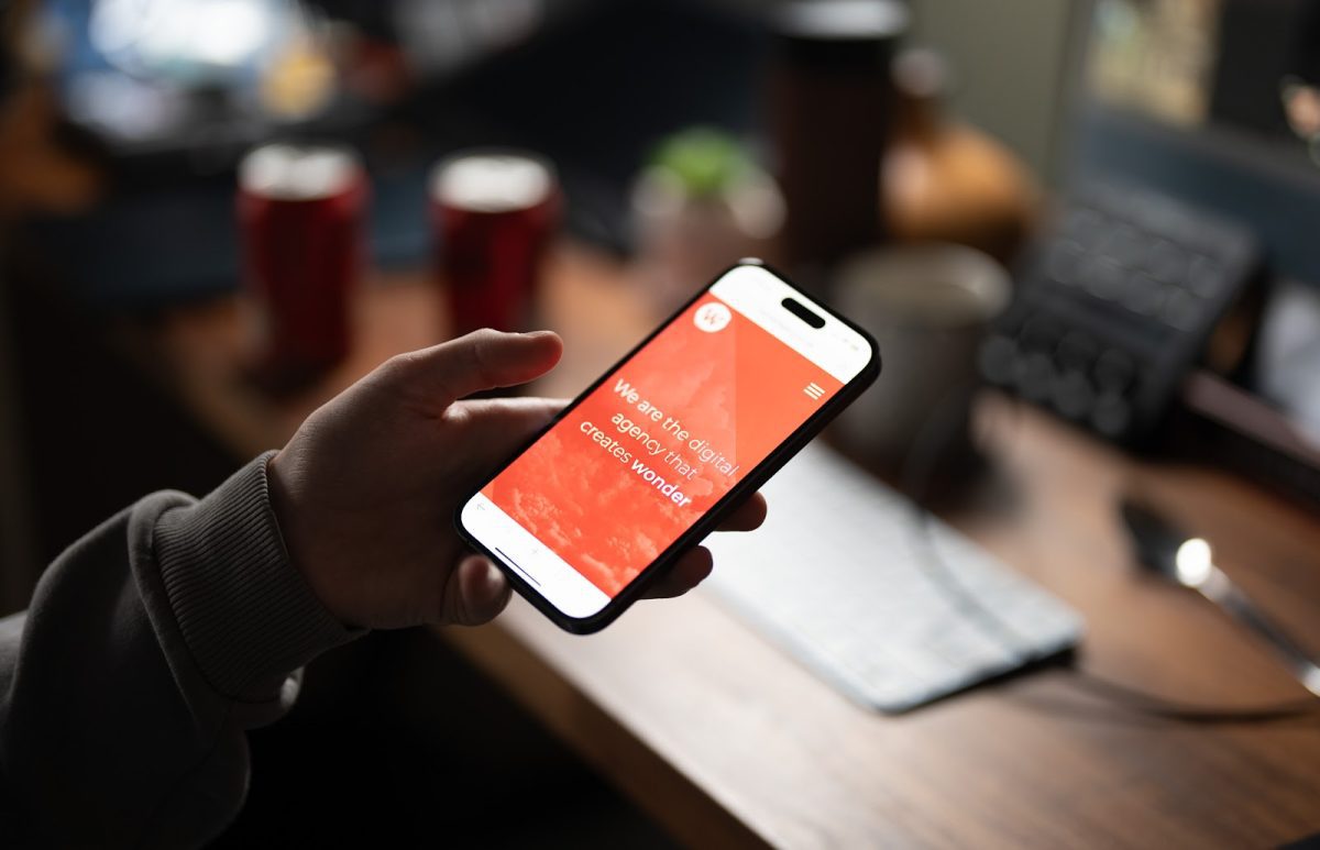 Person visiting The Wonder Agency website on a mobile phone