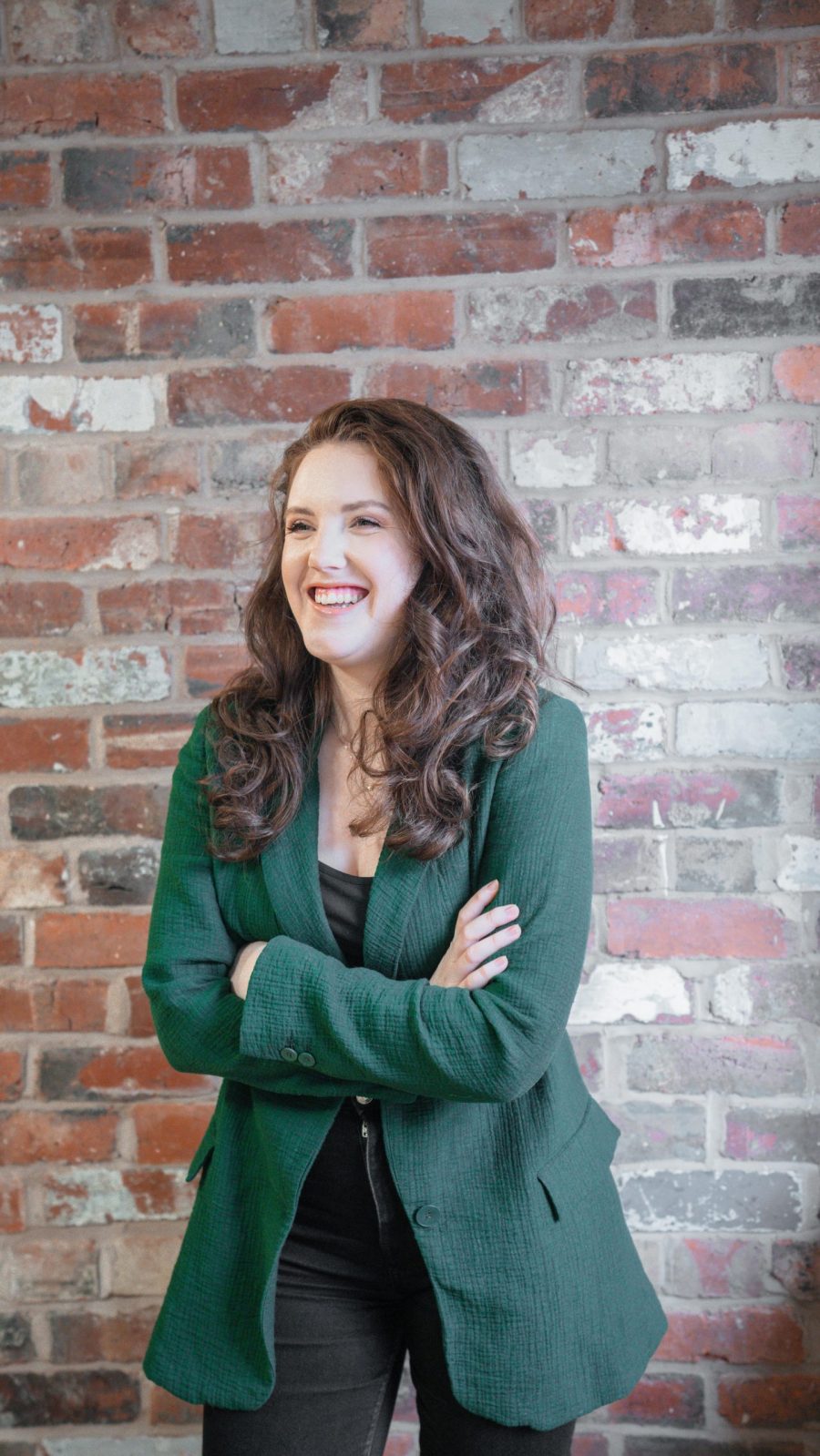 Amy lee, director of the wonder agency, stood in front of brick wall