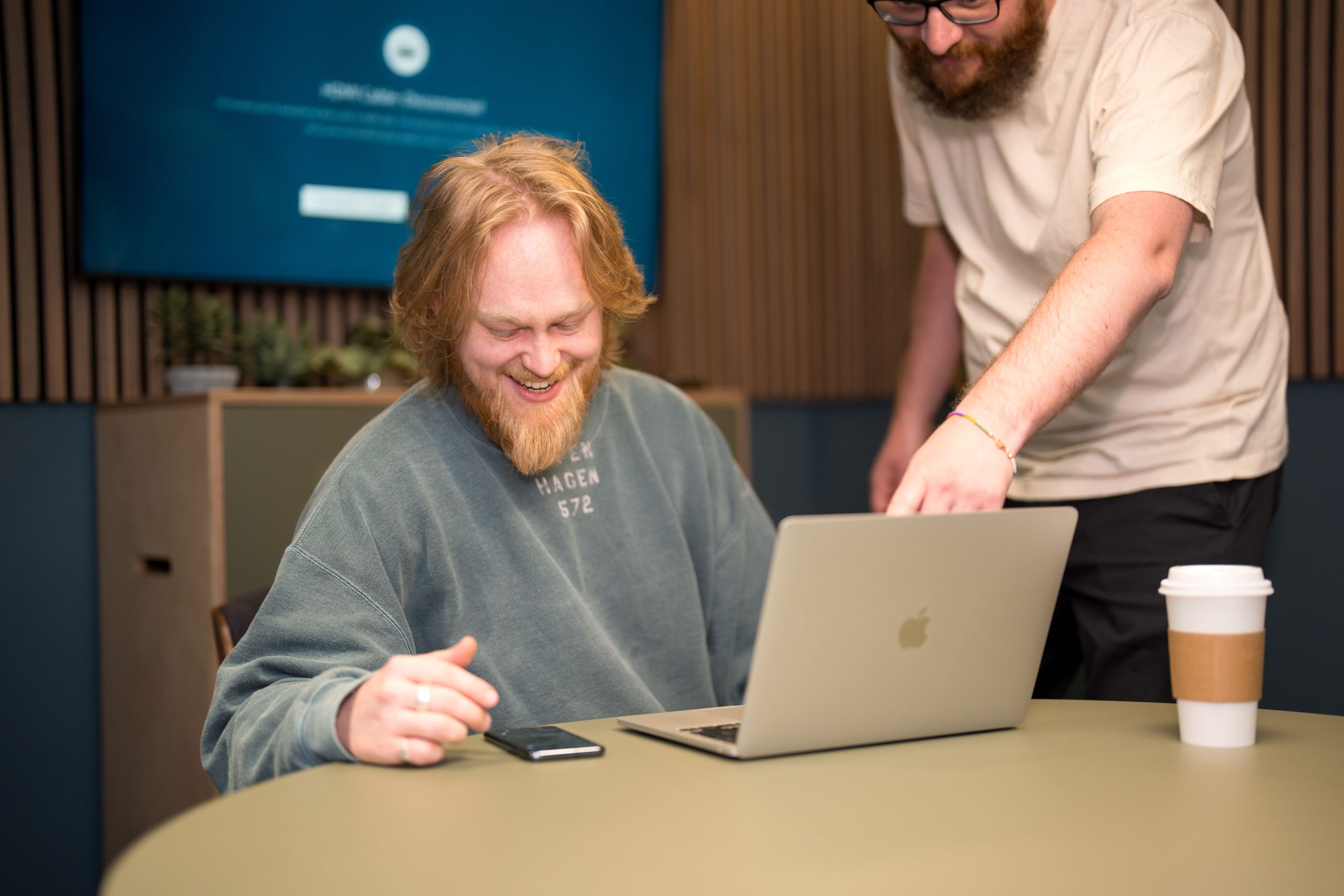 jacob and sam from the wonder agency QA testing website on phone and laptop