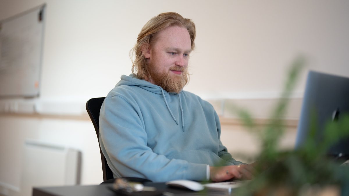 jacob from the wonder agency coding on a laptop