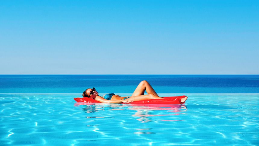 woman floating in pool on a jet2 holiday