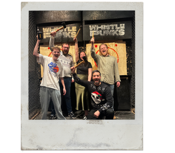 a polaroid frame of the wonder agency team axe throwing