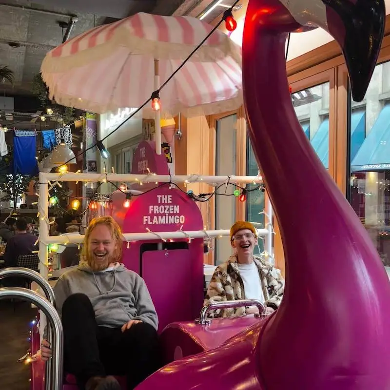 Jacob and Harry from The Wonder Agency on a flamingo boat