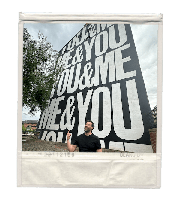 Steve Lee Director of The Wonder Agency in front of You&Me mural in Leeds