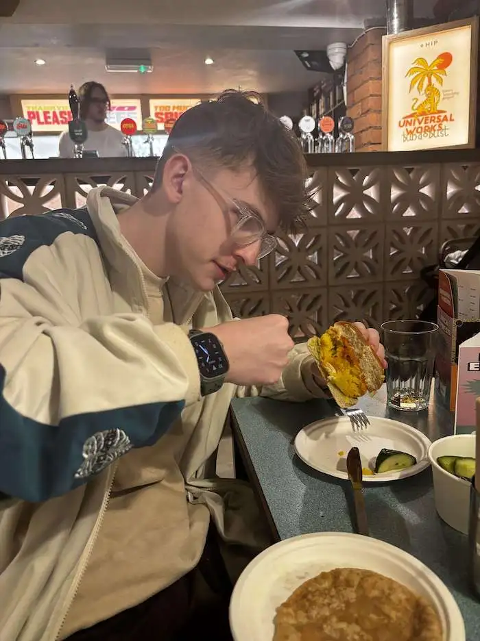 harry from the wonder agency punching a vada pav