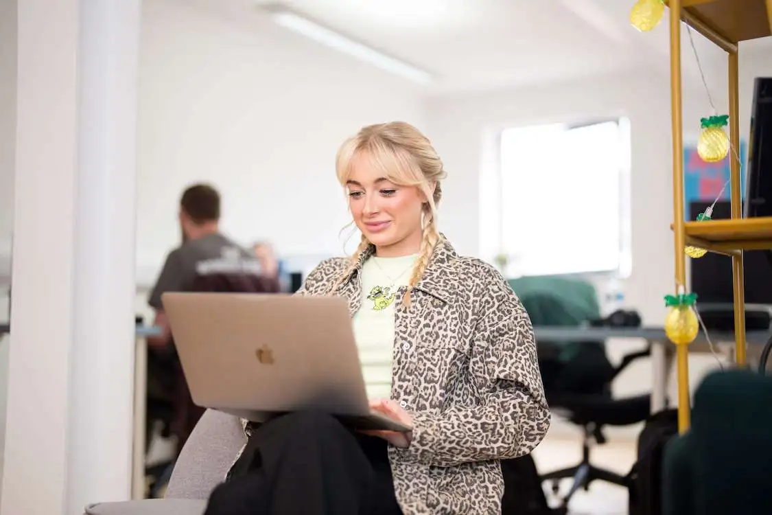 meg from the wonder agency working on laptop