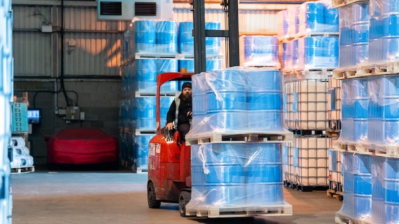 Man driving pallets through a warehouse, featured on a case study on Wonder Agency's WordPress website build for Jenkar Shipping.