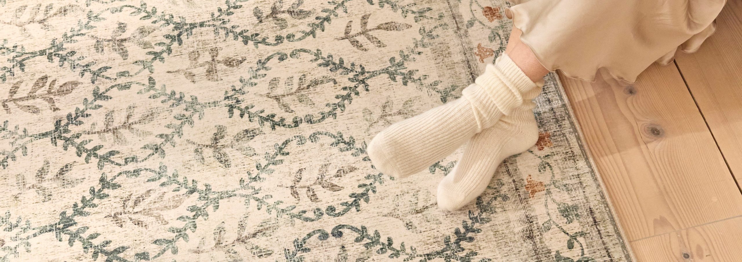 Feet on a rug, featured on a case study on Wonder Agency's Shopify website build for Hug Rug case study