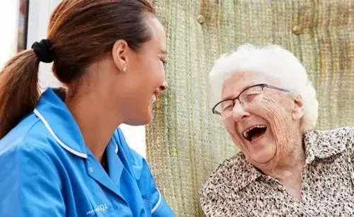 live-in-carer-laughing-with-patient