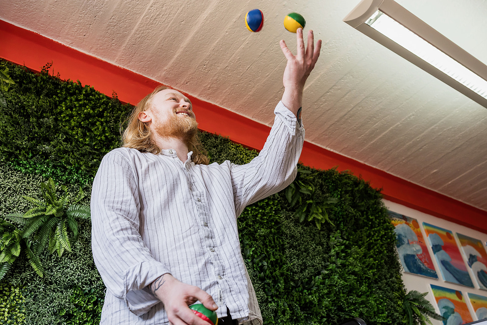 Wonder Agency team member juggling in the office